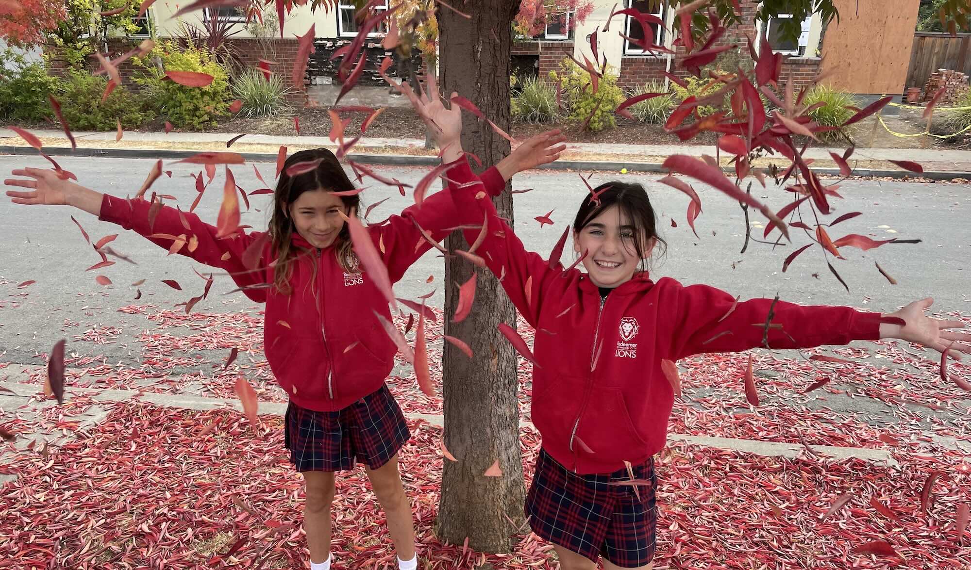 Students under fall leaves
